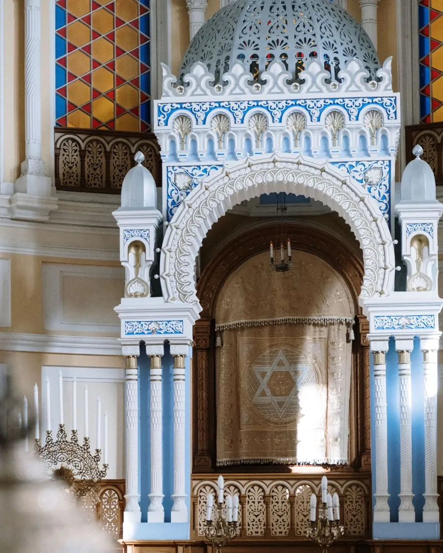 Ornate Torah ark with a Star of David curtain in a synagogue sanctuary